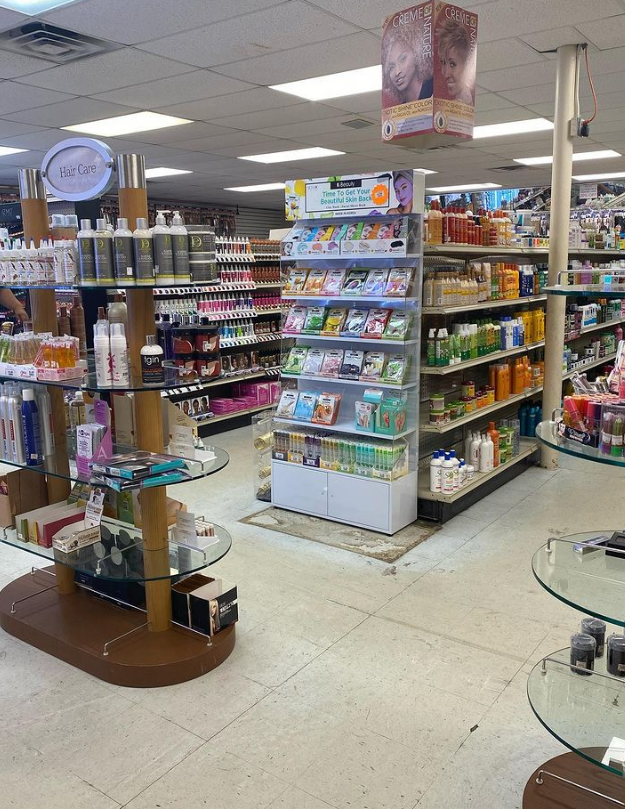 Our hair care tower and the aisles of bottles behind it