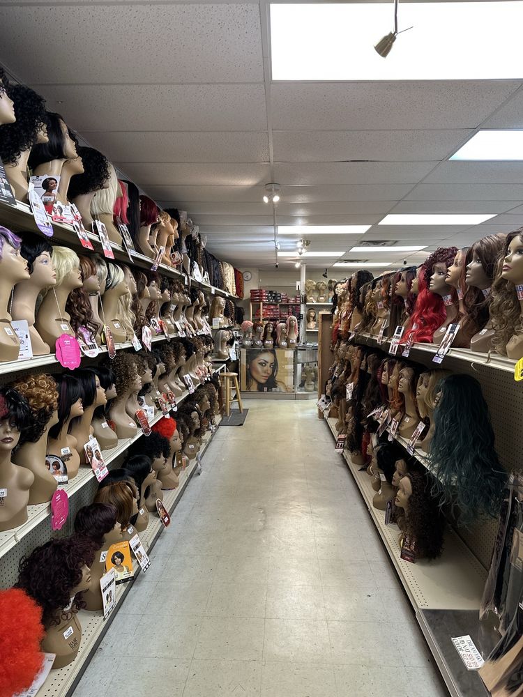 Our wig aisle, heads on both sides leading to the counter