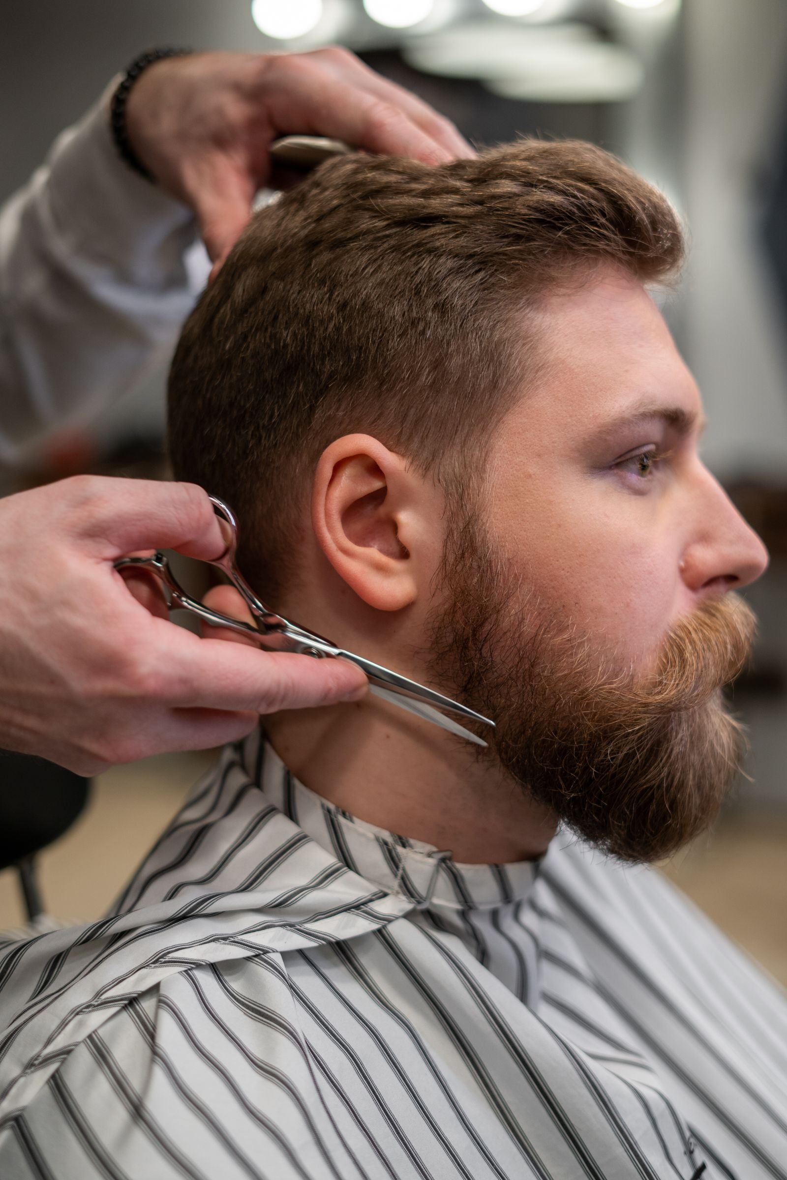 A beard trim in the chair