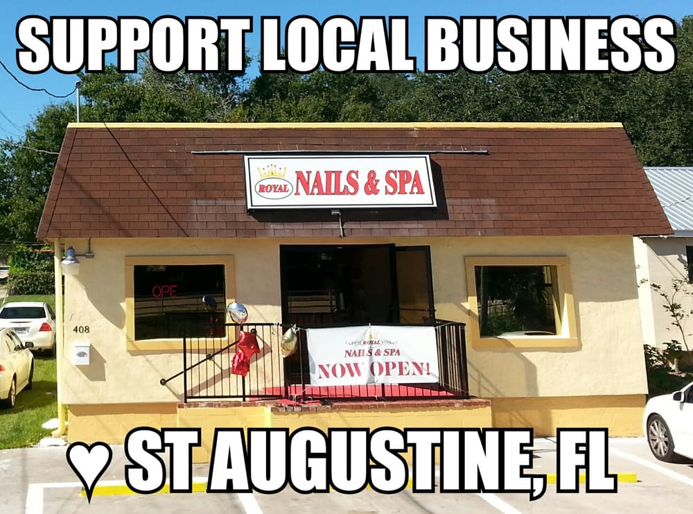 Our yellow shop at 408 S Ponce de Leon Blvd, Royal Nails and Spa on the roof sign, a Now Open banner, and a red carpet at the door.
