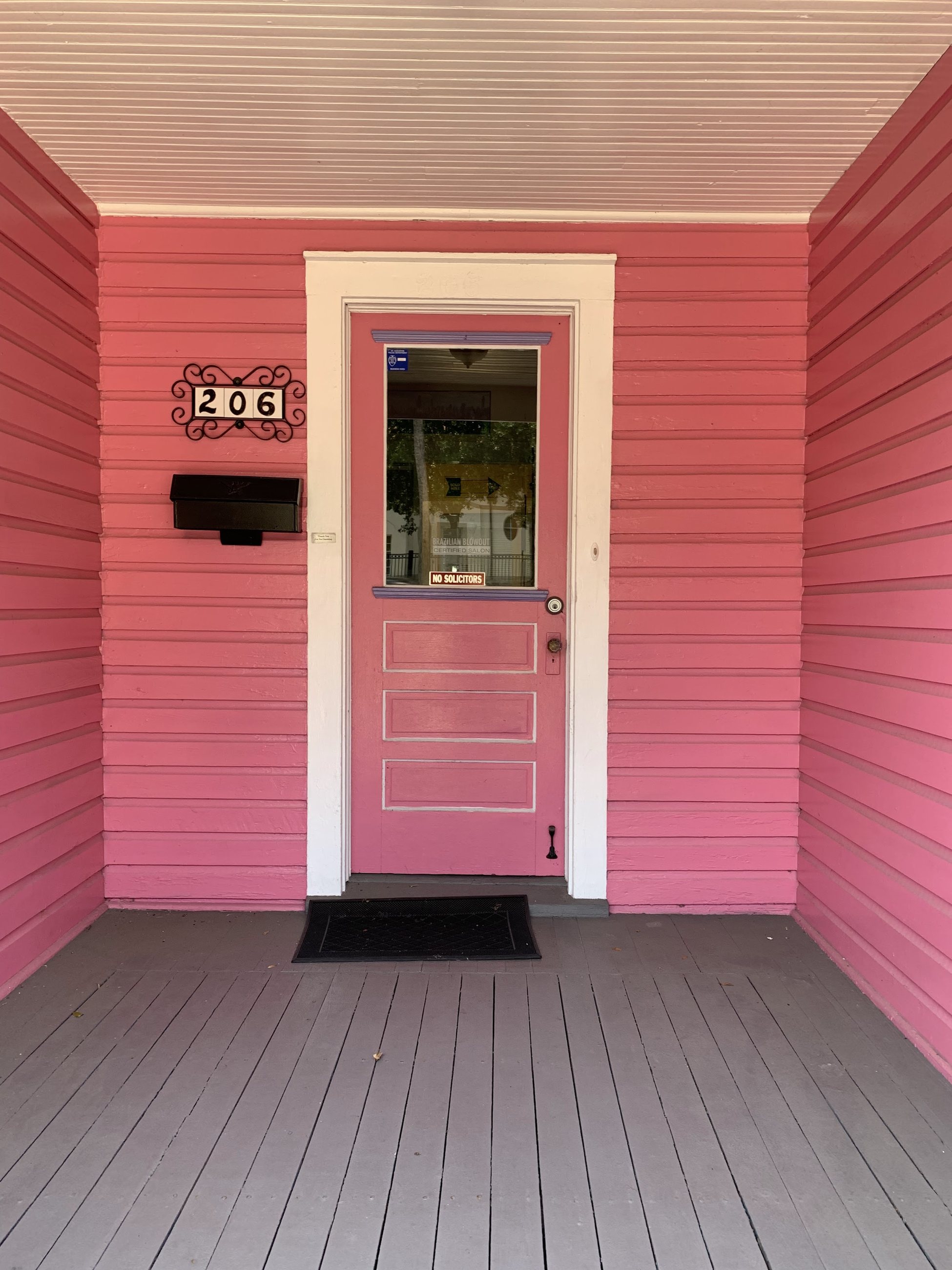 Our pink door and porch at 206 San Marco Ave.