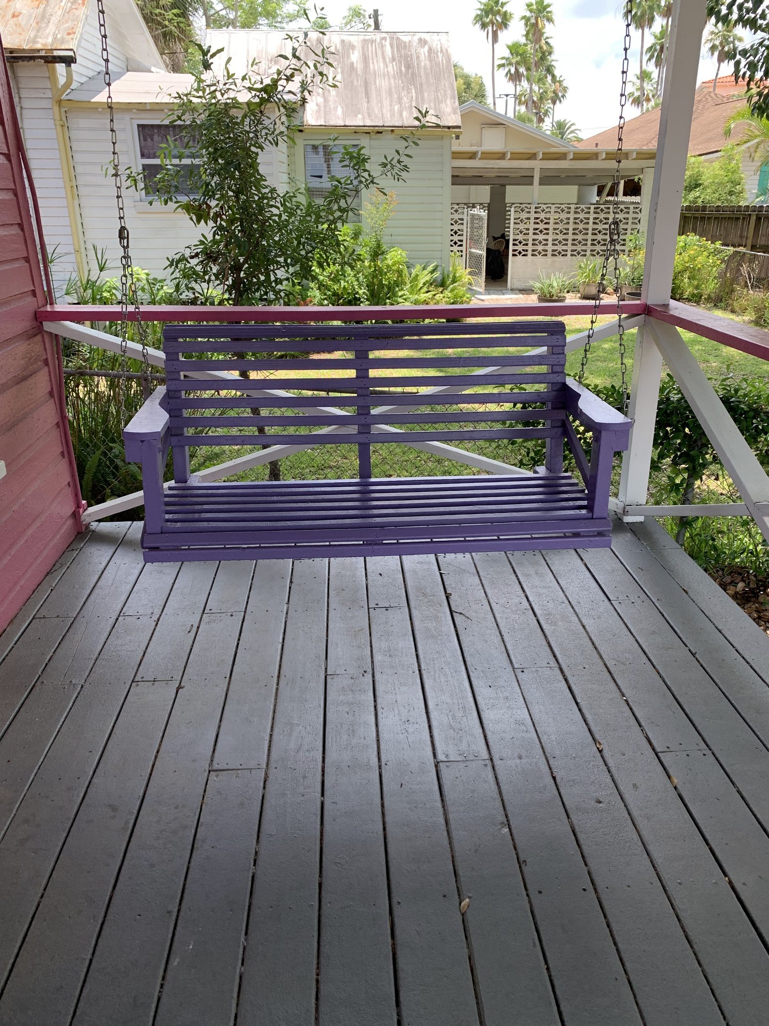 The purple porch swing on our San Marco cottage.