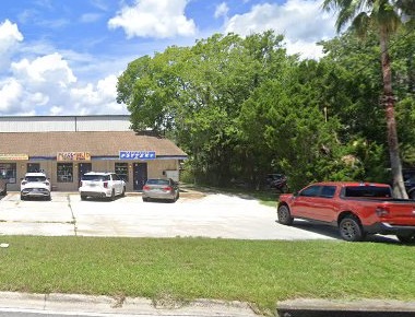 Our row of shops at Old Dixie Plaza, Blue Dolphin sign on the building