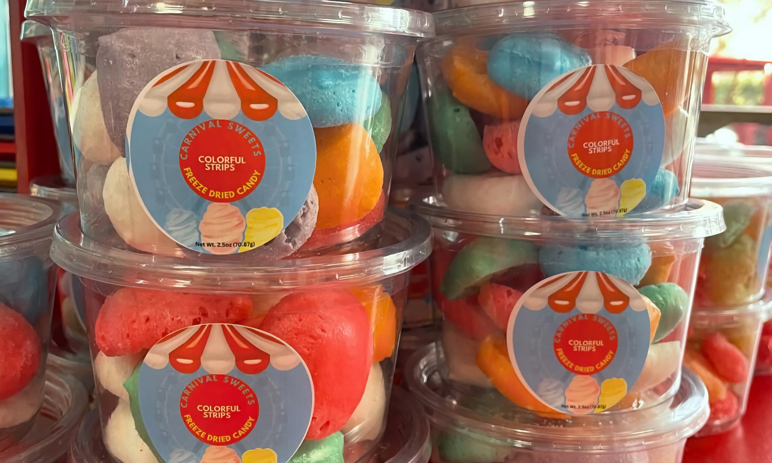 Our Carnival Sweets freeze-dried candy tubs stacked on the counter