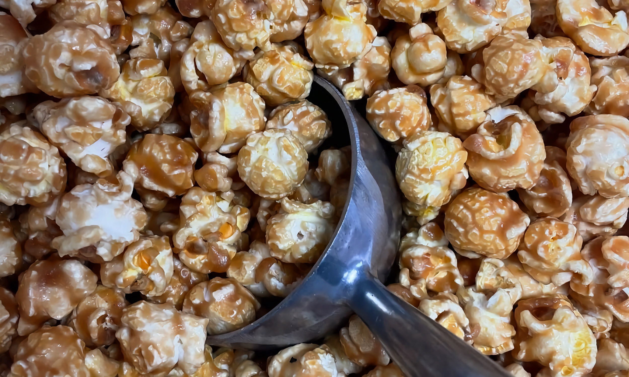 Our caramel popcorn with the metal scoop still in the bin