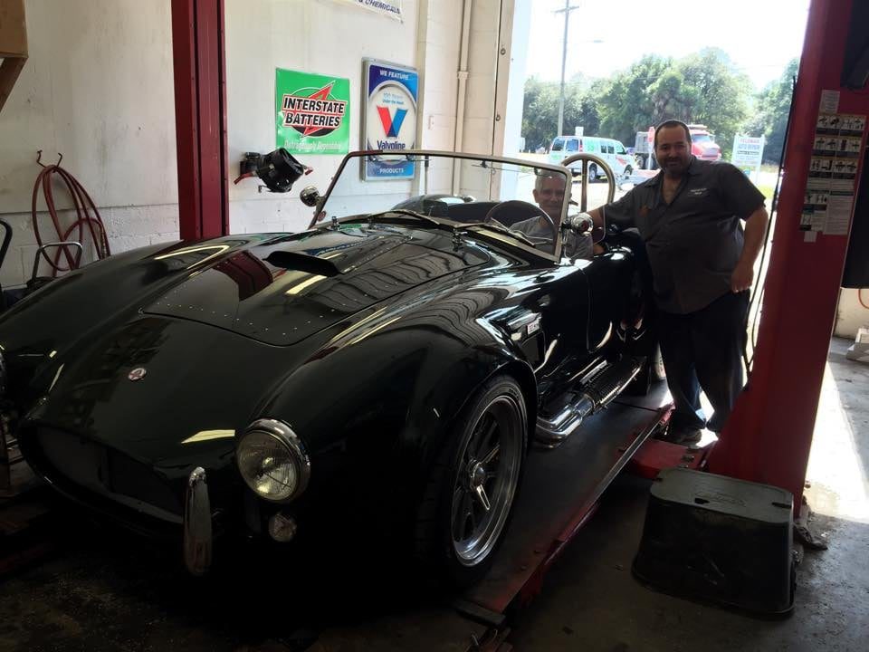 A car on the lift in our bay