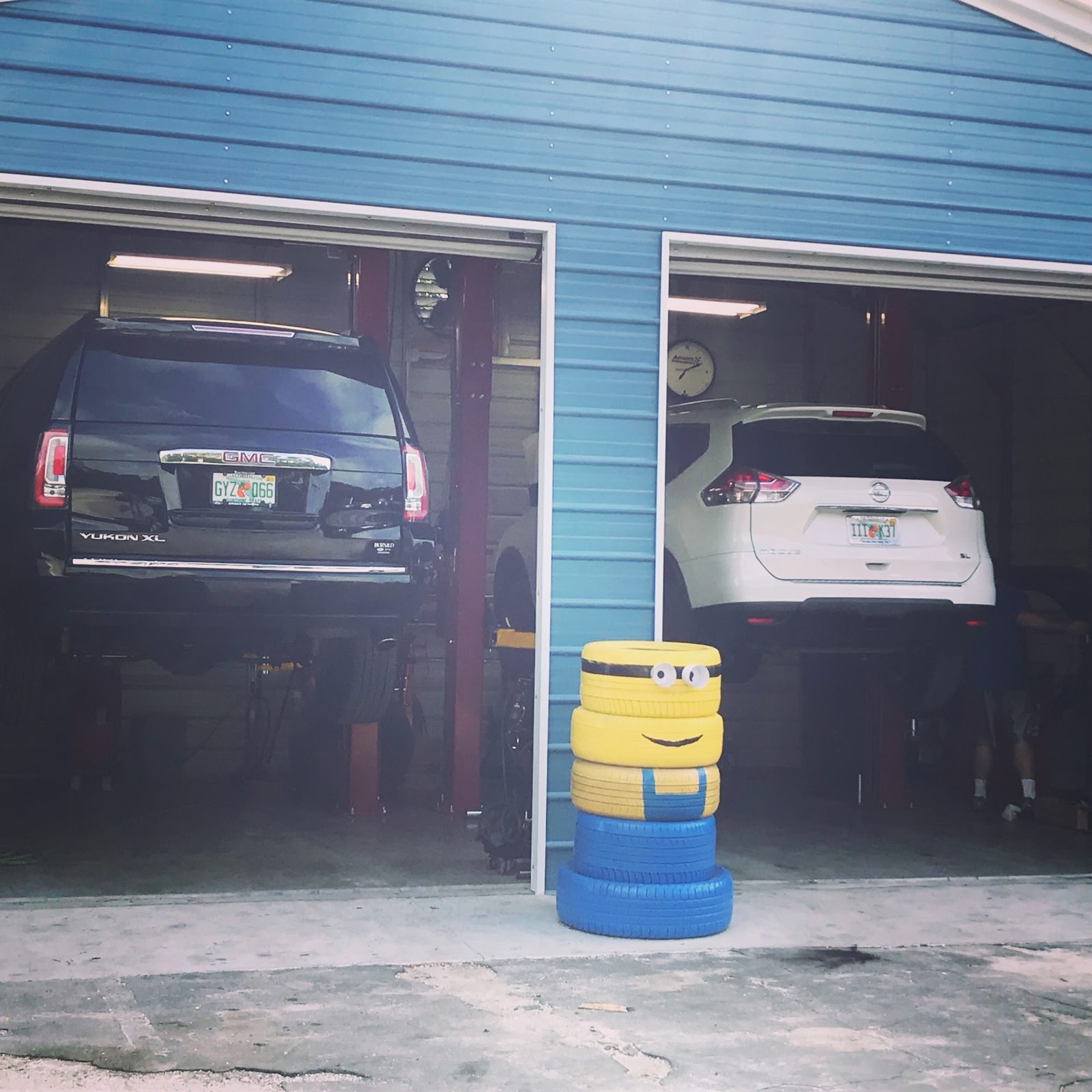 Two of our bays with trucks on the red lifts