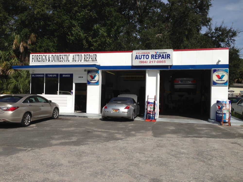 Our white shop with oil changes, tune-ups, and brakes on the windows