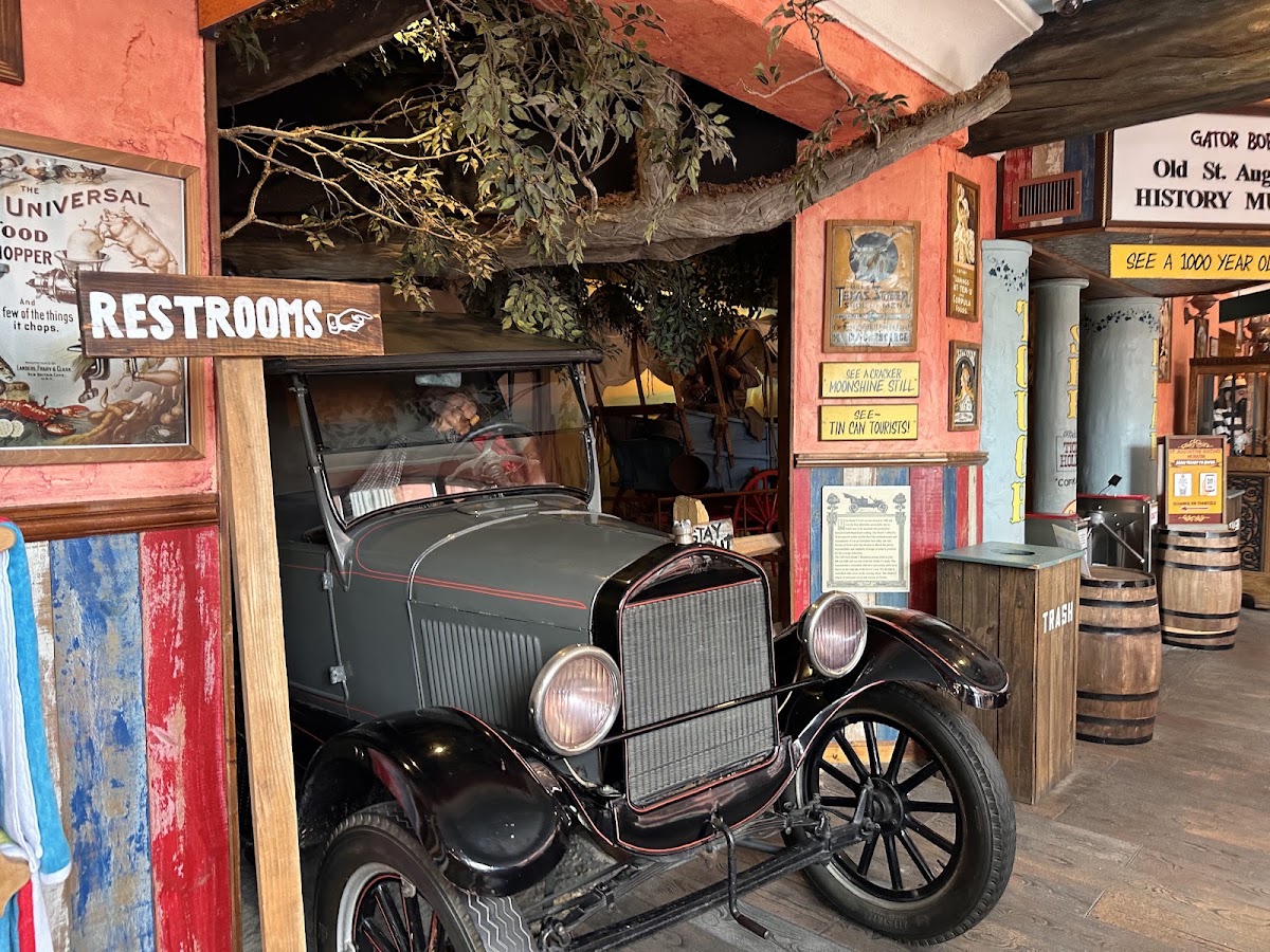 The history museum inside our post: old car, swamp trees, restrooms that way