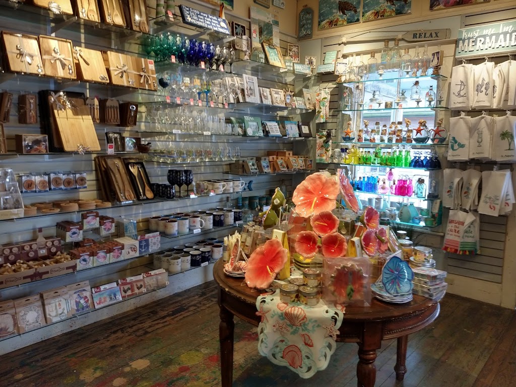 Mugs, glass bowls, and beach kitchen bits on our round table