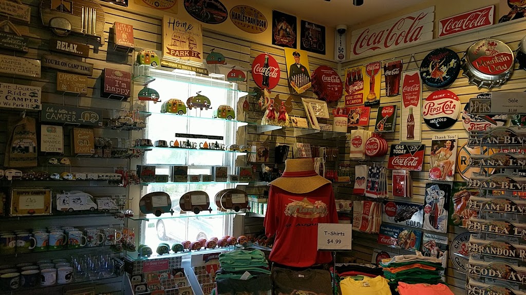 Our sign wall: Coke tins, Harley plaques, and name-your-street signs