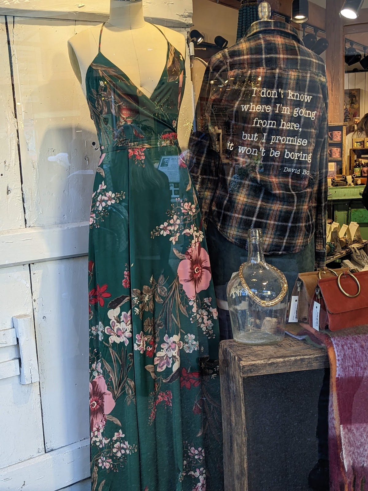 Mannequins in a floral maxi dress and a printed jacket in our window