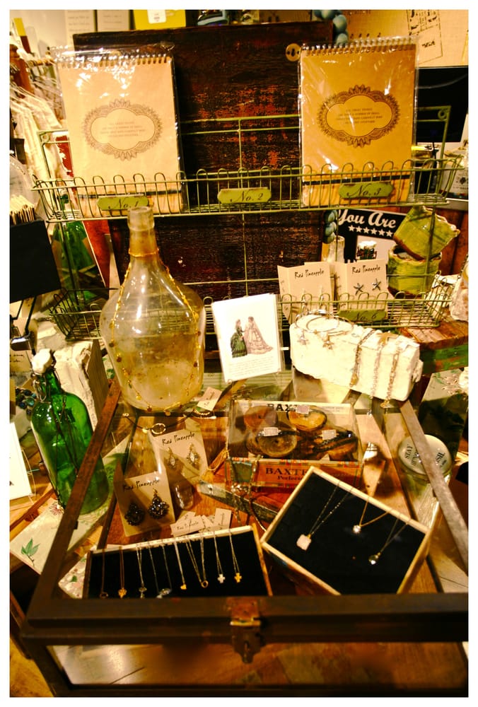 Jewelry, journals, and glass bottles on our display table