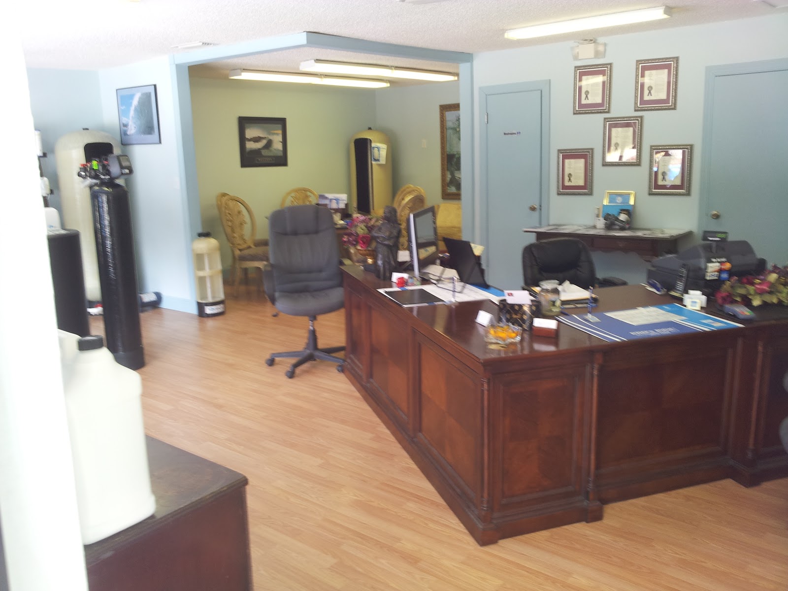 Our desk in the showroom, tanks behind the chairs