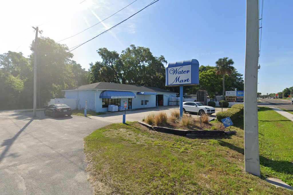 Our Water Mart sign, 25 cent diamond, and blue awning on North Ponce
