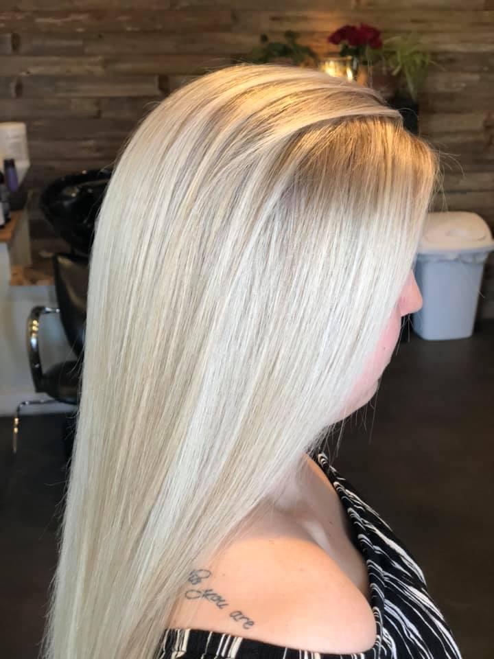 Sleek platinum blonde we colored at the wood-wall station.