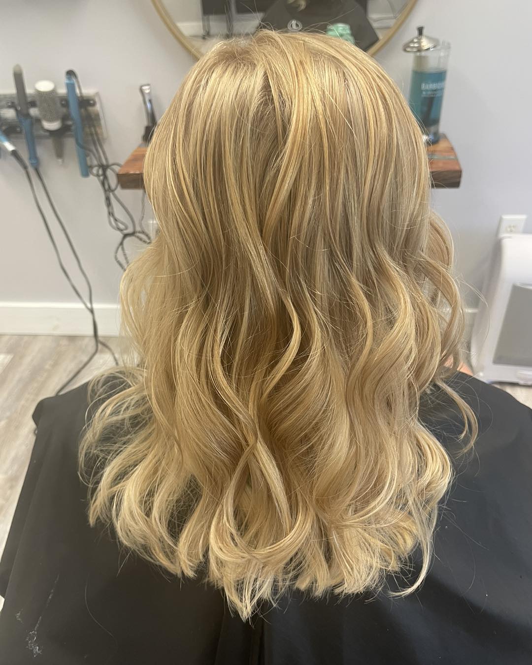 Honey blonde waves after color and a curl iron at our station.