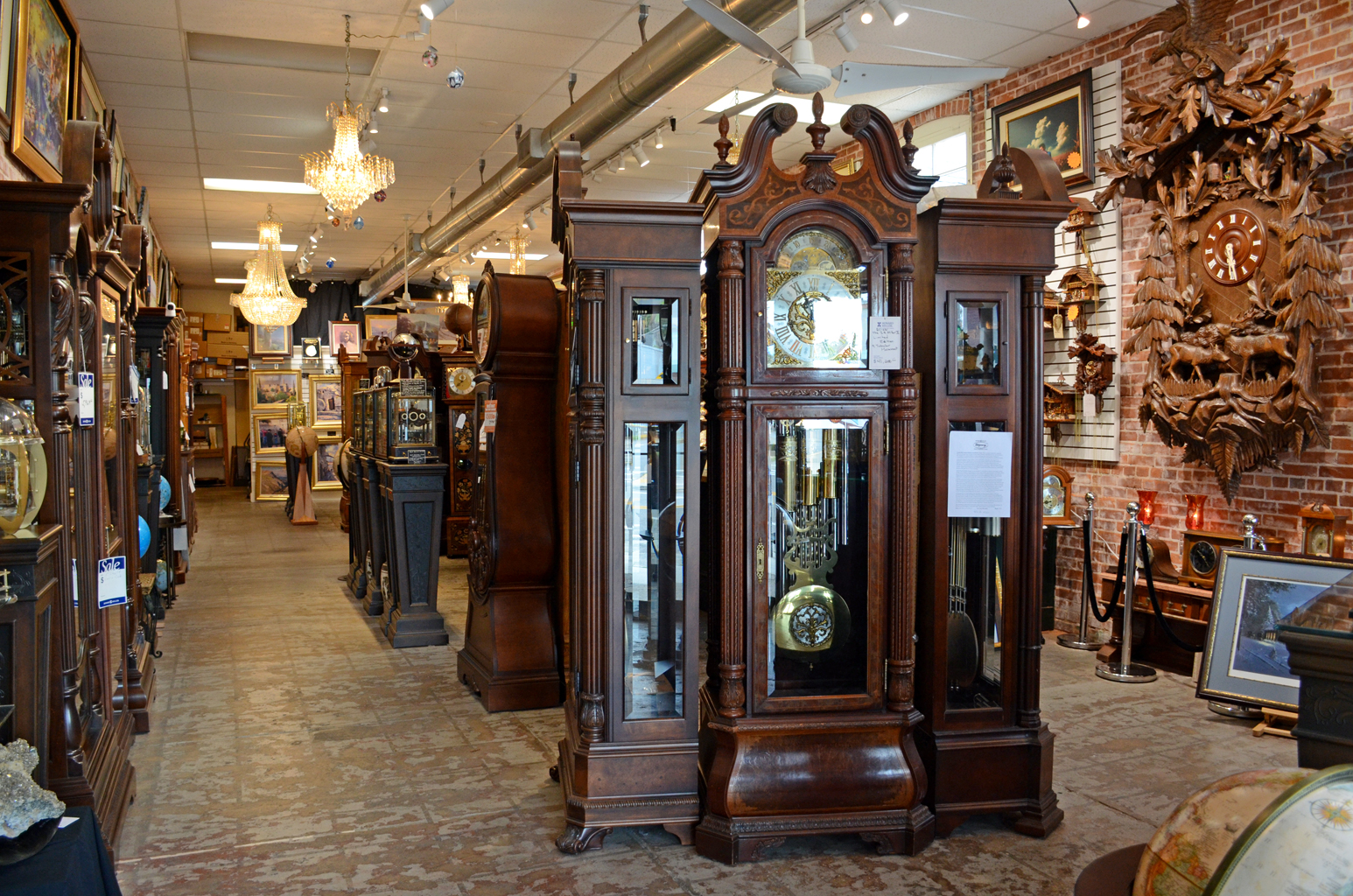 Our aisle: grandfather clocks, the giant cuckoo on the brick, art on the walls.