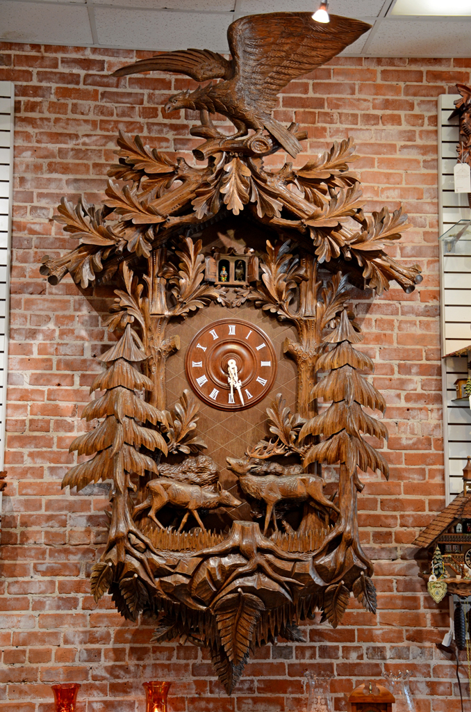 Our giant carved Black Forest cuckoo on the brick wall.