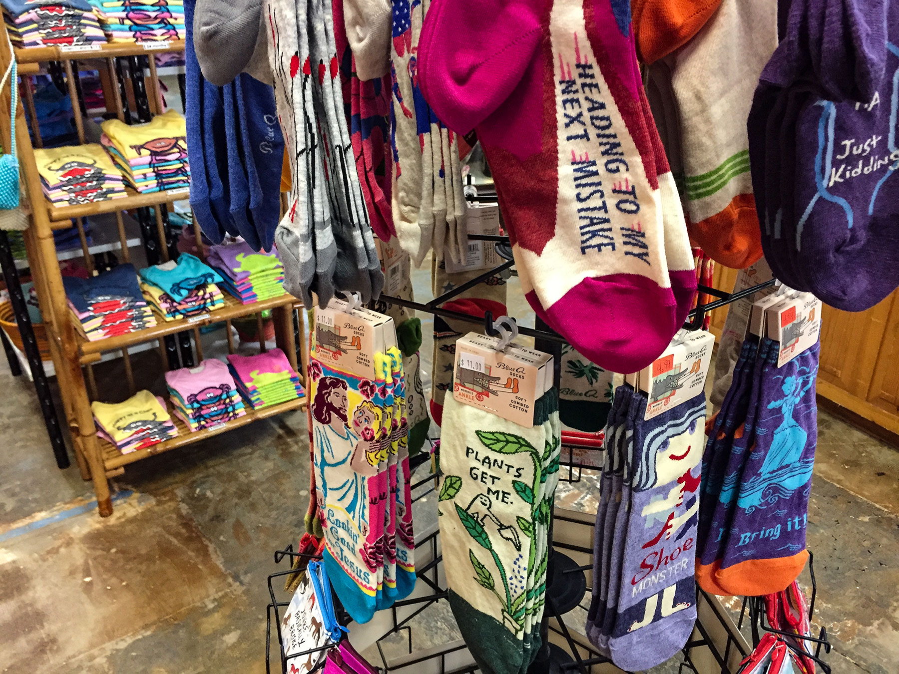 Our novelty sock spinner. Blue Q tags show $11.