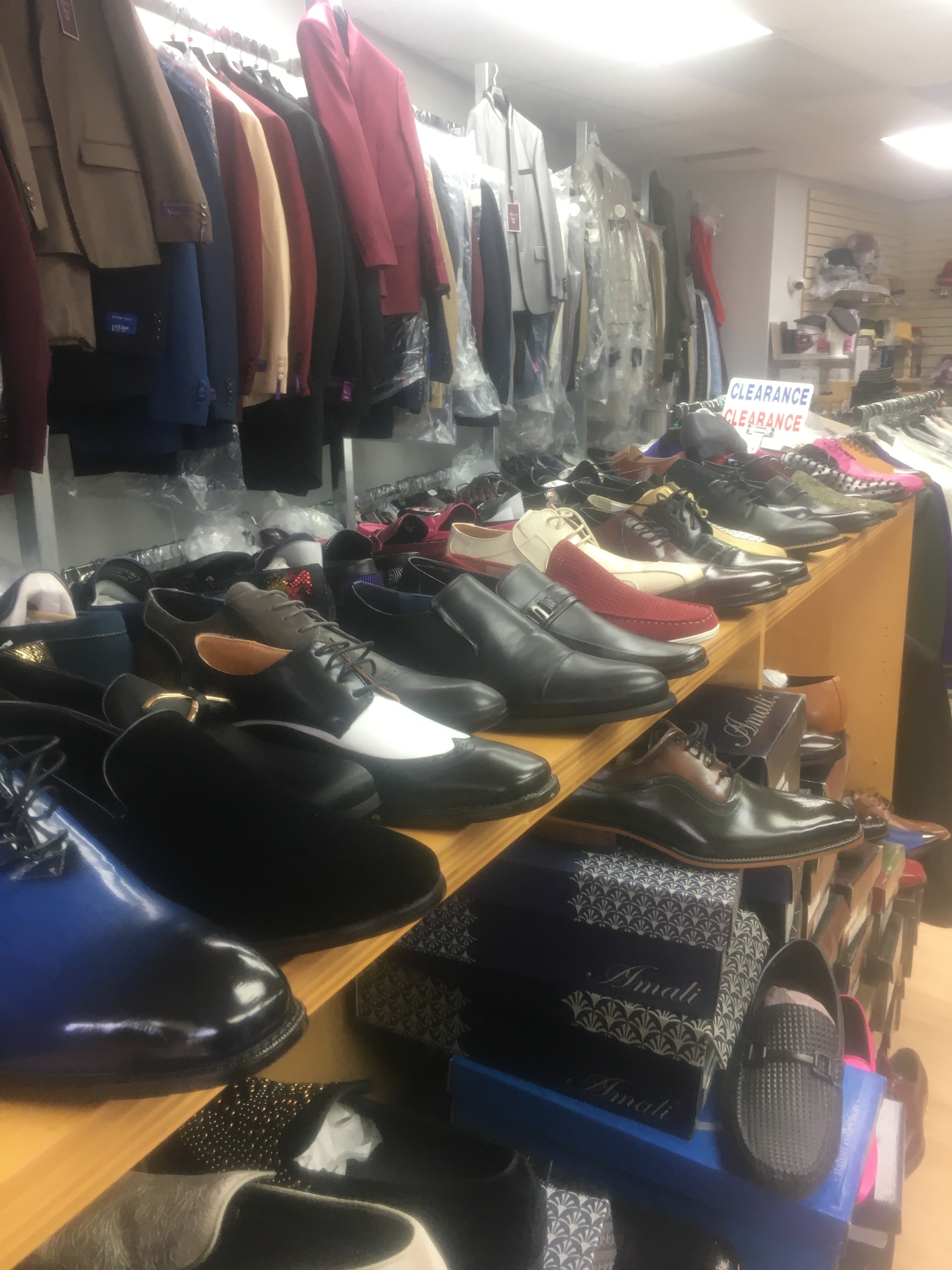 Our floor: dress shoes on the shelves and jackets on the rack in Unit G.