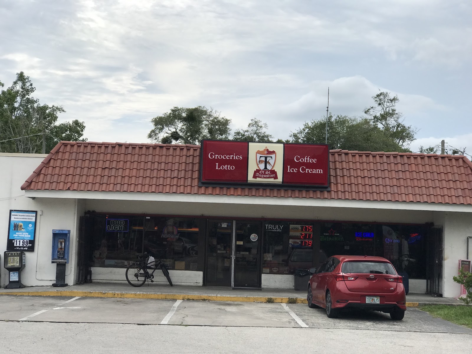 Tiger of Saint Augustine storefront at 52 San Marco Ave, with Groceries, Lotto, Coffee, and Ice Cream on the sign.