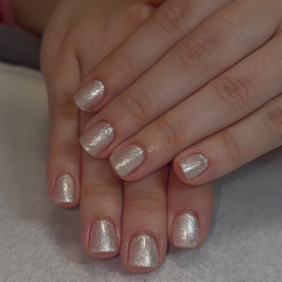 Short square nails in champagne glitter.