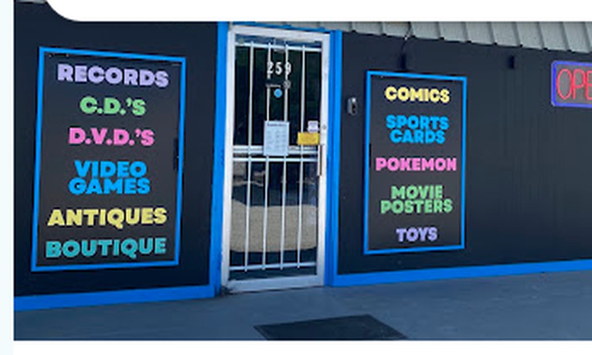 Our black storefront at 259, cyan trim, and the painted windows.