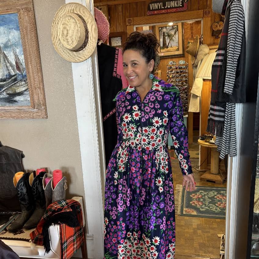 Vintage dresses, hats, and boots in our clothing room.