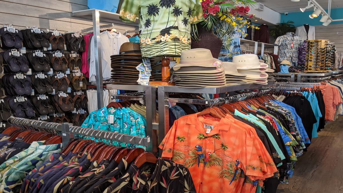 Our aisle of cotton shirts, hats, and the teal wall