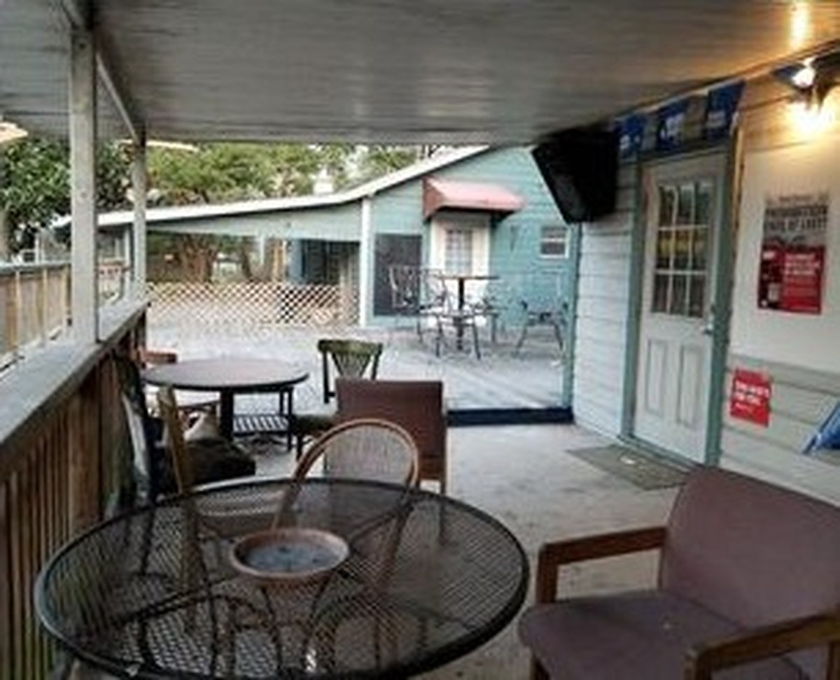 Our covered deck with tables and chairs