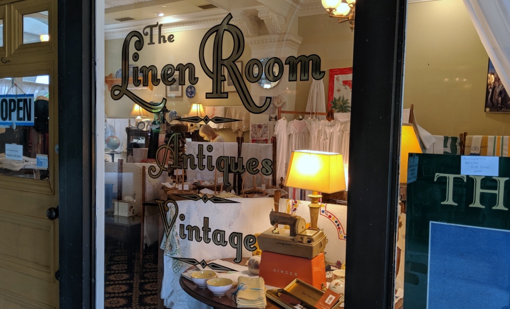 Our window on King Street. The Linen Room, Antiques, Vintage, lettered on the glass.