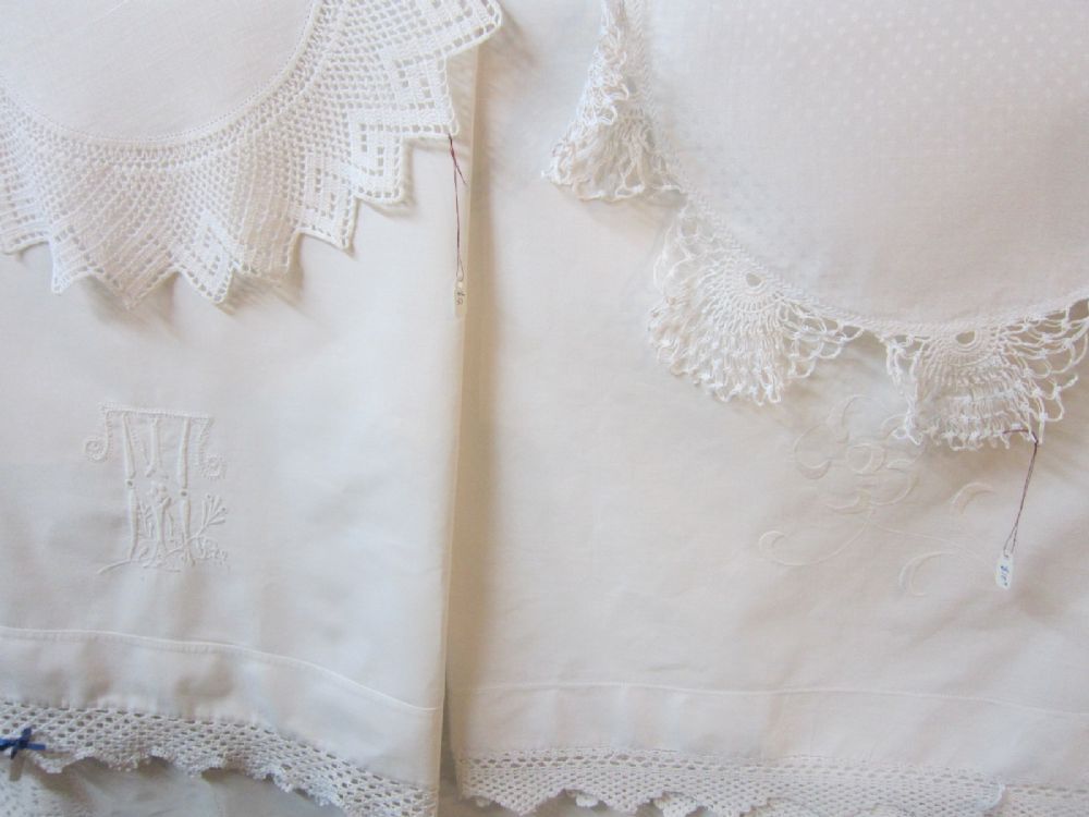 White-on-white lace trims and an embroidered monogram on our linens.