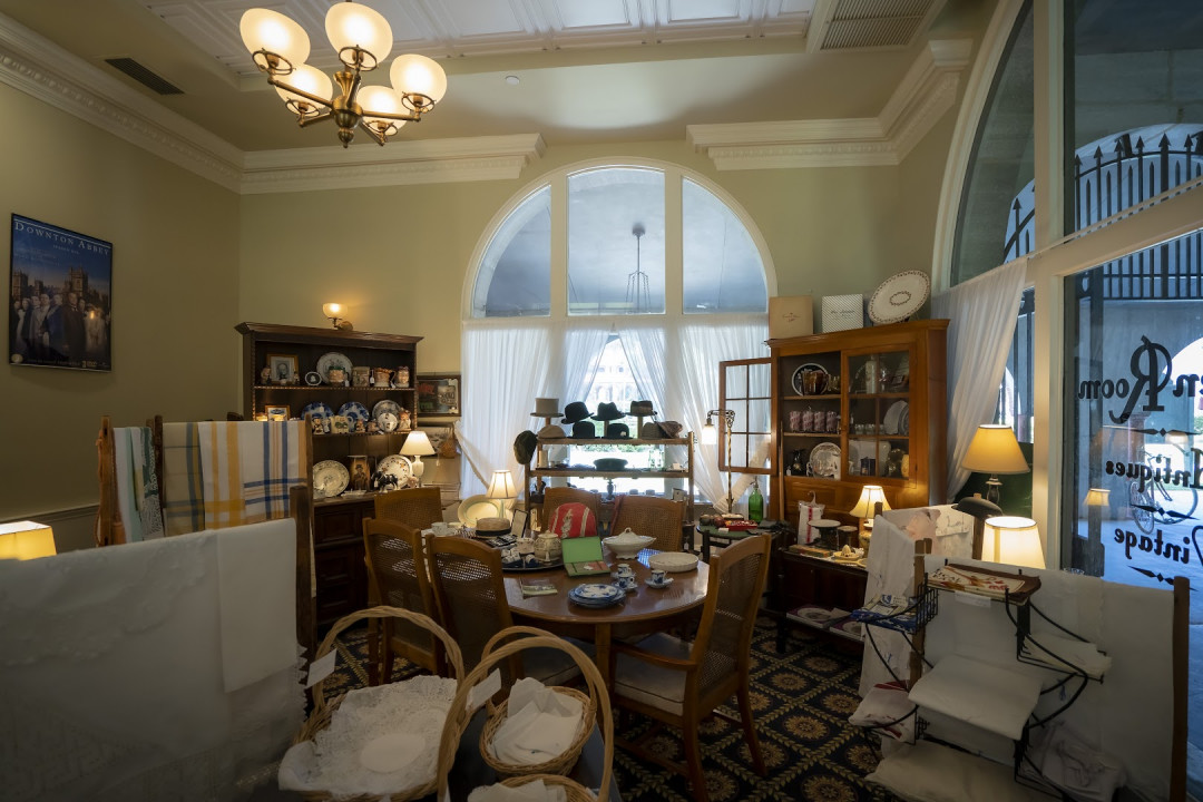 Our floor, the glass counter, hanging lace, and the arched window onto the courtyard.
