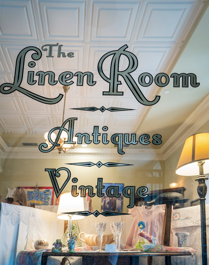 Looking in from King: crystal glasses, lace, and our lettering on the glass.
