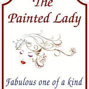 The Painted Lady mark: a lady in profile with a floral swirl of hair.