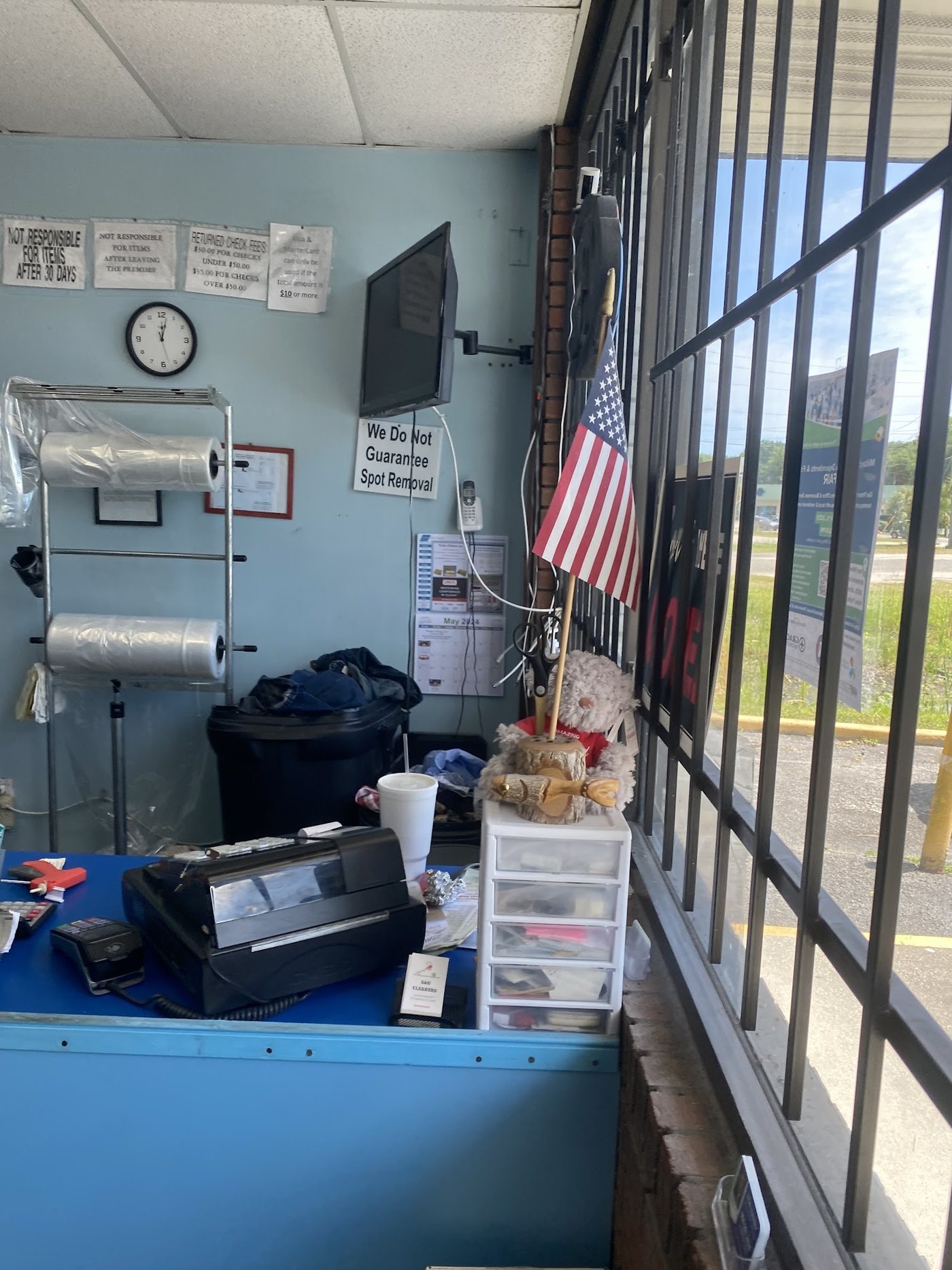 Our counter on State Road 207, register, bags, and the rail behind Sid