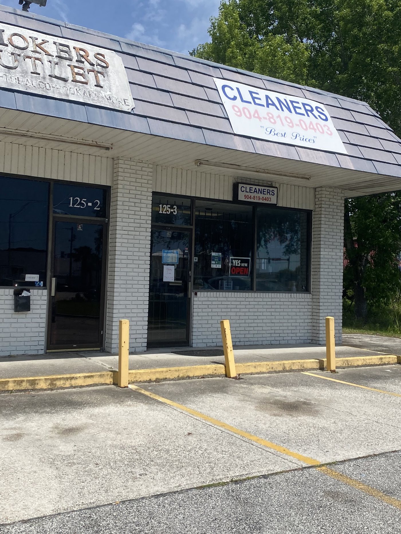 Our shop at 125 State Road 207 with the Cleaners sign
