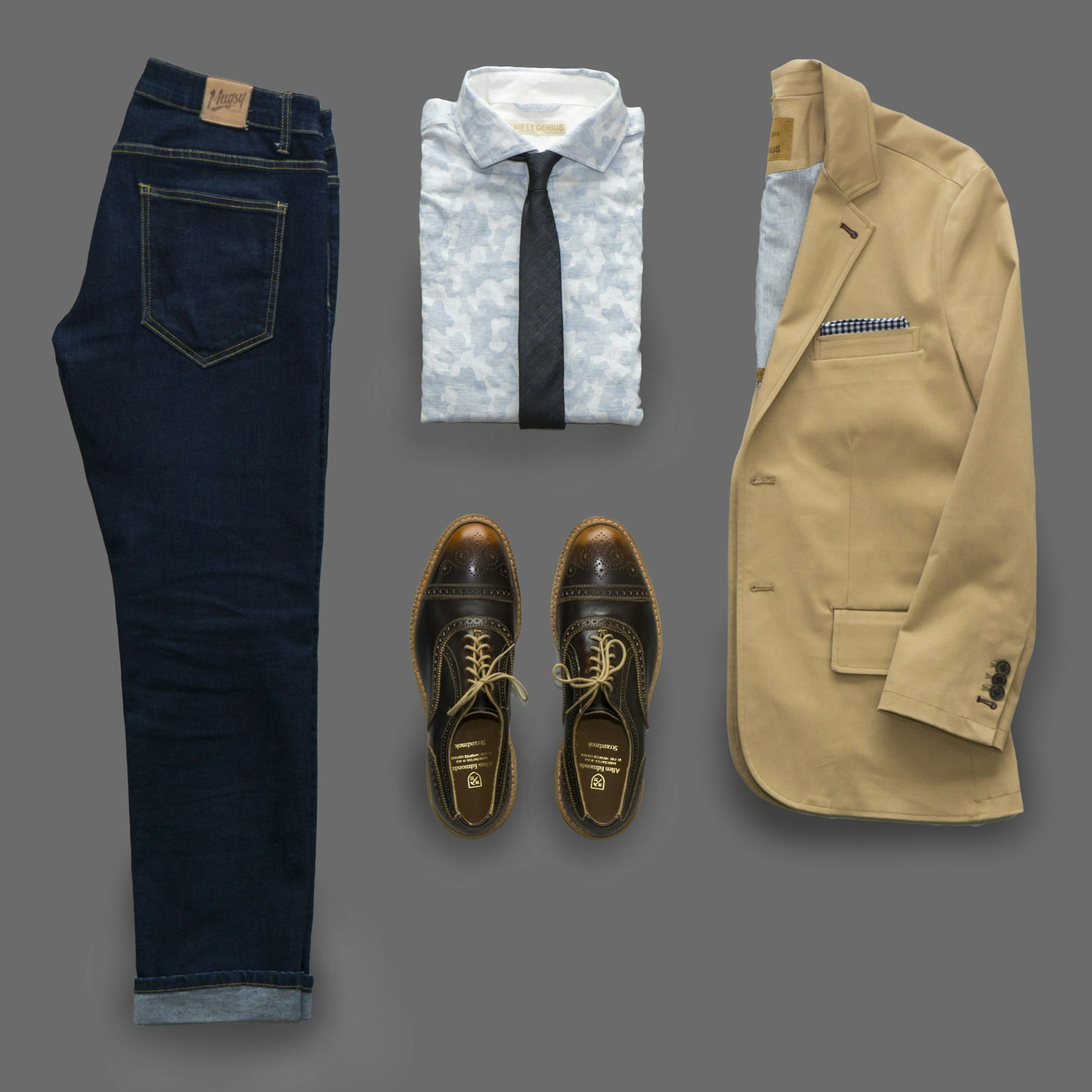 Our shirts, a jacket, and shoes laid out the way we send work back.